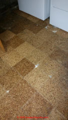 Asbestos likely in this corkstyle floor tile installation - depending on agae (C) InspectApedia.com Eri