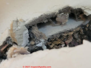 Top of pipe insulation, not asbestos -(C) InspectApedia.com Johan