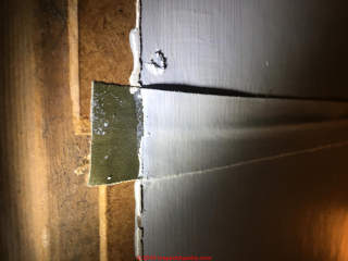 Duct taped fiberboard panels (C) InspectApedia.com reader