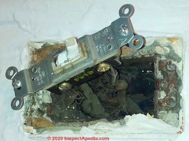 lectrical wire insulation material in a 1919 building (C) InspectApedia.com Cat