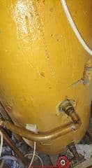 Yellow water cylinder foam insulation won't be asbestos (C) InspectApedia.com Barney