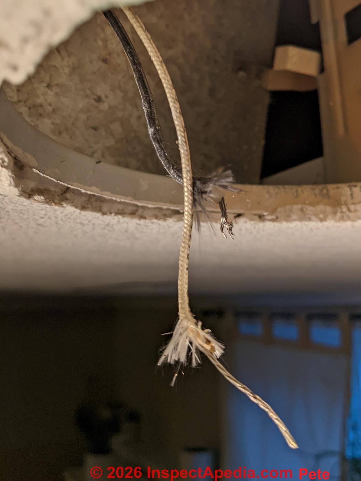Asbestos in 1960s ceiling light -(C) InspectApedia.com Pete