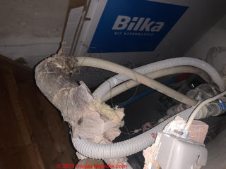 Paper-covered fiberglass pipe insulation - not asbestos (C) InspectApedia.com Kaj