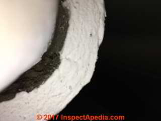 Felt type pipe insulation in a U.K. installation (C) InspectApedia.com D Friedman & JL