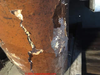 Furnace pipe insulatin flaking off pipe (C) InspectApedia.com Jprows