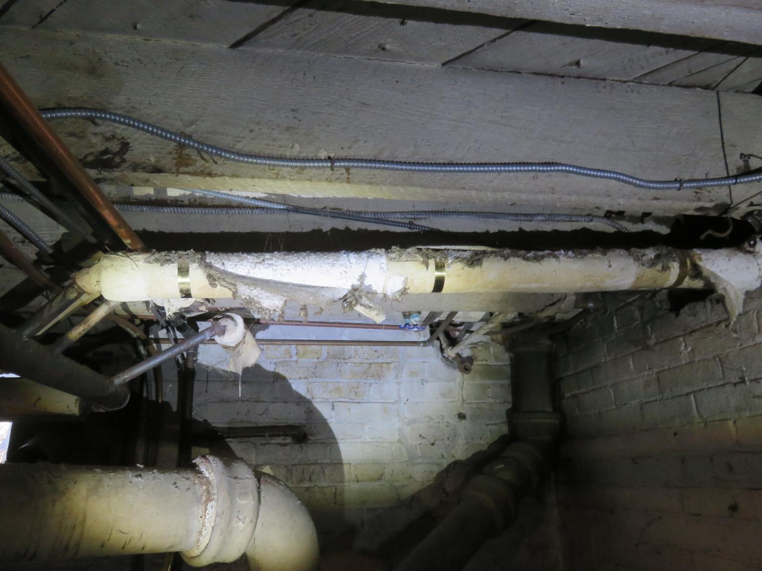 Asbestos pipe insulation needing encapsulation (C) Daniel Friedman 79 Raymond Ave Pok