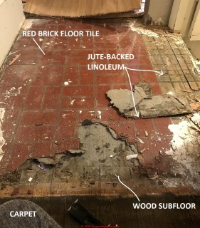 Red brick pattern linoleum badly damaged (C) InspectApedia.com reader