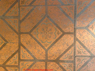 red pattern textured speckled floor tile (C) InspectApedia.com Evelyn