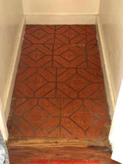 red pattern textured speckled floor tile (C) InspectApedia.com Evelyn