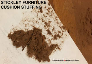 Stickley furniture cushion stuffing: celluose, wood product, animal hair not asbestos (C) Inspectapedia.com Mike