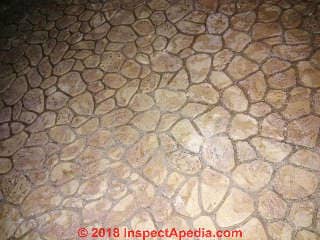 Pebble or stone pattern sheet flooring from 1970s probably contains asbestos (C) InspectApedia.com John