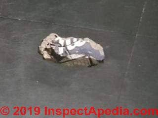 Asbestos floor tile in the UK - asphalt asbestos (C) InspectApedia.com Danielle Eaves