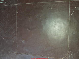Asbestos likely in these 1940s brown floor tiles in East Yorkshire UK (C) InspectApedia.com Mark Robbins