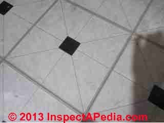 Possible asbestos containing self adhesive Emerald Vinyl Floor Tiles (C) InspectApedia.com