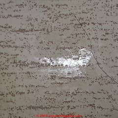 2% asbestos in floor tile (C) InspectApedia.com MK