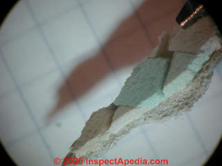 Marble chip resilient flooring known to contain asbestos (C) Daniel Friedman at InspectApedia.com Two Harbors MN