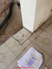 Asbestos suspect flooring (C) InspectApedia.com Payne