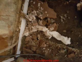 Wall debris may contain asbestos (C) Inspectapedia.com Jongas