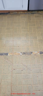 1974-75 white brick pattern sheet flooring asbestos (C) InspectApedia.com KastanA