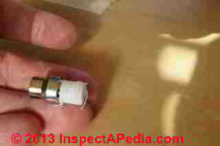 Hot water heat air bleed valve preparation with teflon tape (C) Daniel Friedman