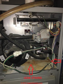 Leaks at a condensing gas boiler or furnace - where is the leak source? (C) InspectApedia.com Tim