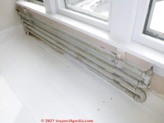 Home made hot water heating radiator made from 1 1/4" pipe in a 120 year old New Jersey Home (C) InspectApedia.com Transue Lawrence