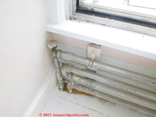 Home made hot water heating radiator made from 1 1/4" pipe in a 120 year old New Jersey Home (C) InspectApedia.com Transue Lawrence