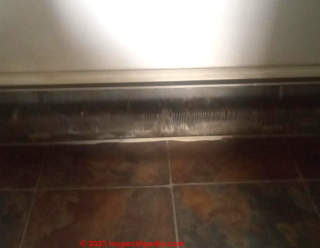 damaged baseboard heater in rental unit (C) InspectApedia.com Courtney