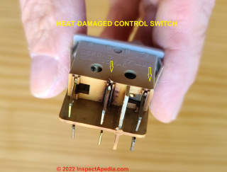 Heat damaged control switch from portable electric heater (C) Daniel Friedman at Inspectapedia.com