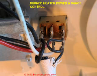 Damaged by heat, this control switch was cracked and brown at its connectors (C) Daniel Friedman at InspectApedia.com
