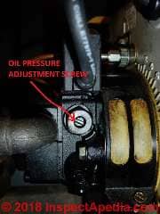 Fuel unit pressure adjustment screw on an oi lburner (C) Daniel Friedman at InspectApedia.com