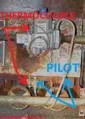 Rusty furnace showing thermocouple & pilot light tubing & assemblies (C) Daniel Friedman