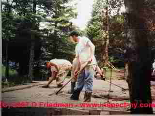 Photograph of workers installing a concrete floor slab  © Daniel Friedman 2007
