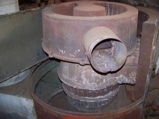 Old gas furnace heat exchanger / vent detail (C) InspectApedia.com Muller D