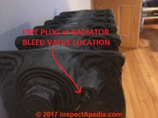 Pipe plug in location where an air bleeder valve is needed at a cast iron radiator (C) InspectApedia.com GG