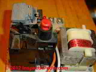 Reset switch on Energy Kinetics Oil Boiler © D Friedman at InspectApedia.com 