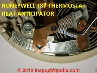 Heat anticipator in a Honeywell T87 thermostat (C) Daniel Friedman at InspectApedia.com