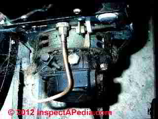 Dirty oil burner pump fuel unit © D Friedman at InspectApedia.com 