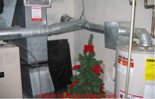Unusual boxed draft hood on residential water heater (C) InspectApedia.com and hankeyandbrown.com images used with permission