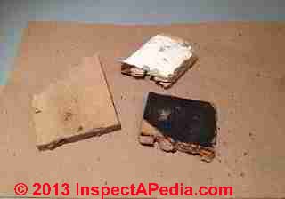 Fiberboard insulation fragments used under bowling alley lanes (C) InspectApedia
