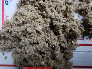 Cellulose insulation combining shredded paper and plant fibers, probably wood (C) Daniel Friedman & KK at InspectApedia.com