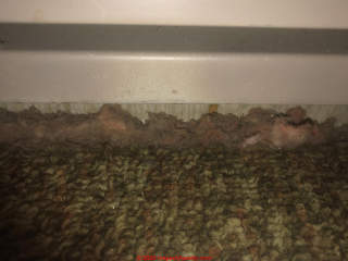 Dusty dirty fiberglass insulation (C) InspectApedia.com Steve