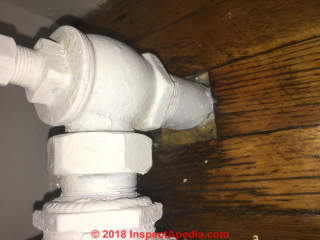 Fiberglass insulation at pipe - wall penetration (C) InspectApedia.com Perry