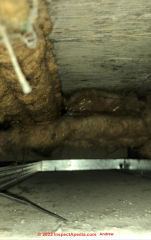 Jute-like pipe insulation in a UK Flat from the 1990s (C) InspectApedia.com Andrew