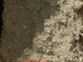 Loose fill cellulose insulation in an atic (C) InspectApedia.com Sandy W