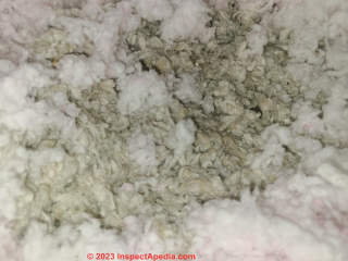 mix of fiberglass and mineral wool insulation (C) InspectApedia.com Rob