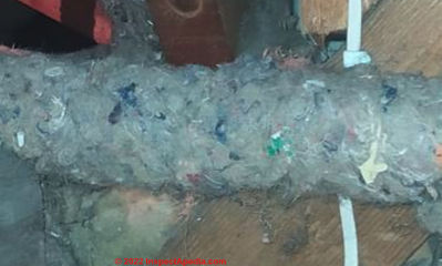 UK pipe lagging in a 1950s London house - work done in the 1990s - probably fabric or wool pipe wrap (C) InspectApedia.com Heyman