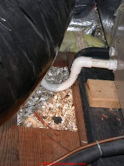 Vermiculite insulation loose fill in an attic at an air handler and ductwork (C) Daniel Friedman at InspectApedia.com