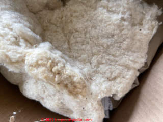 White packing or insluation, probably cotton possibly fiberglass, made in China (C) InspectApedia.com Chris