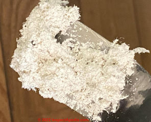 Heavy white powdery blown asbestos insulation in 1863 Indiana home (C) InpsectApedia.com Marco